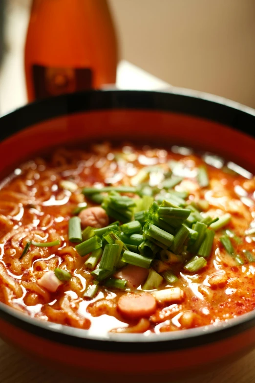 a close up of a red bowl of food