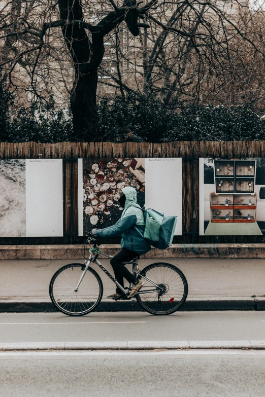 a man riding his bike down the middle of the road