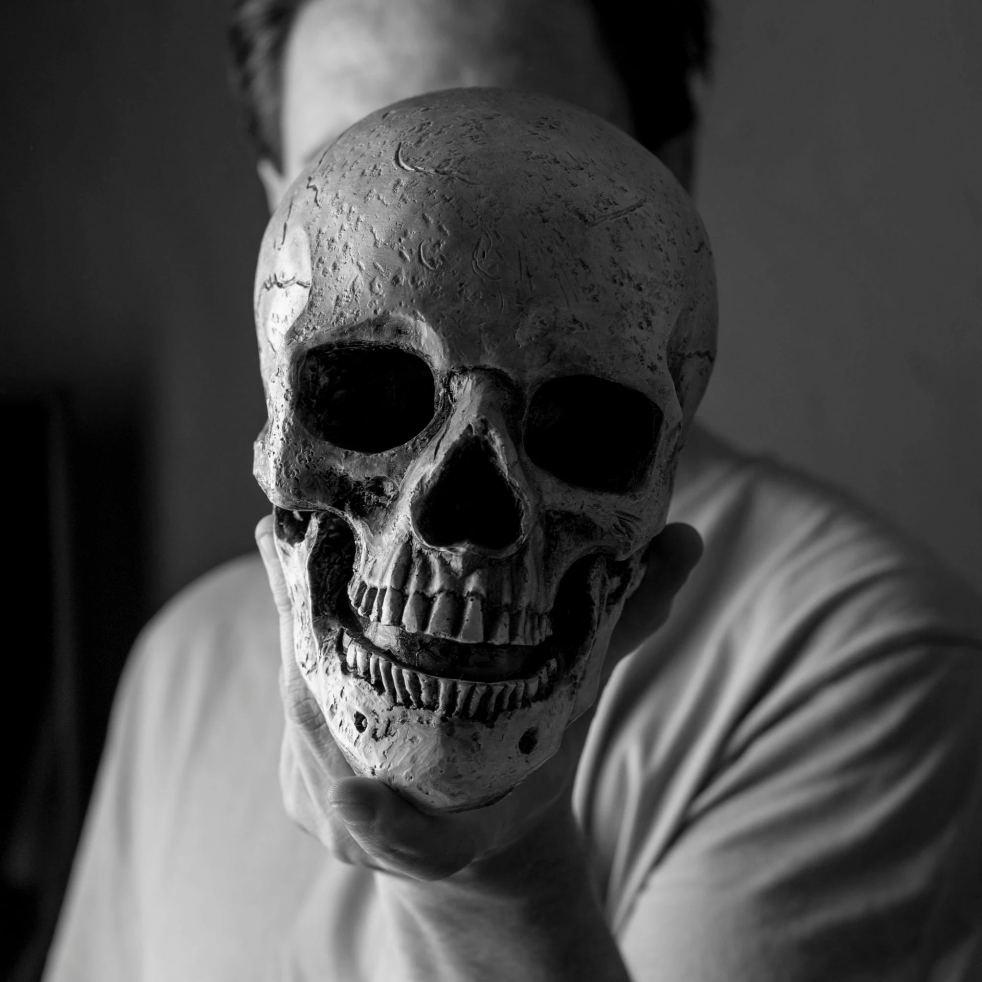 a man with a skull mask over his face