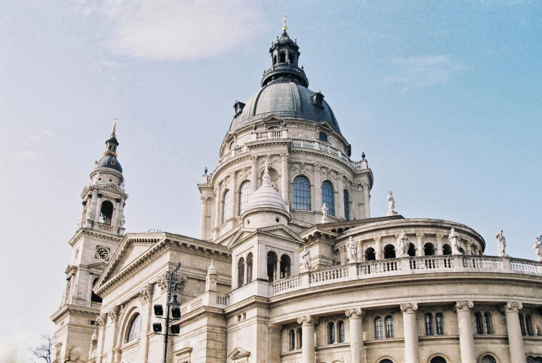 a beautiful building with large towers and clocks on the front