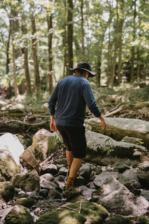 a man that is walking in the dirt