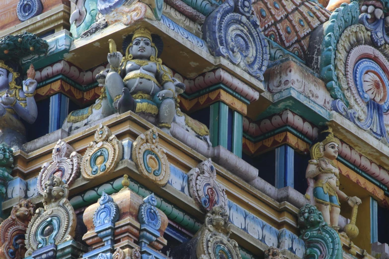 elaborate sculptures decorate the side of a building