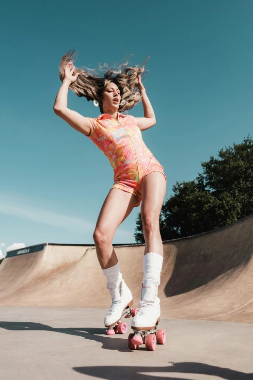 a beautiful young lady riding a skateboard on a ramp