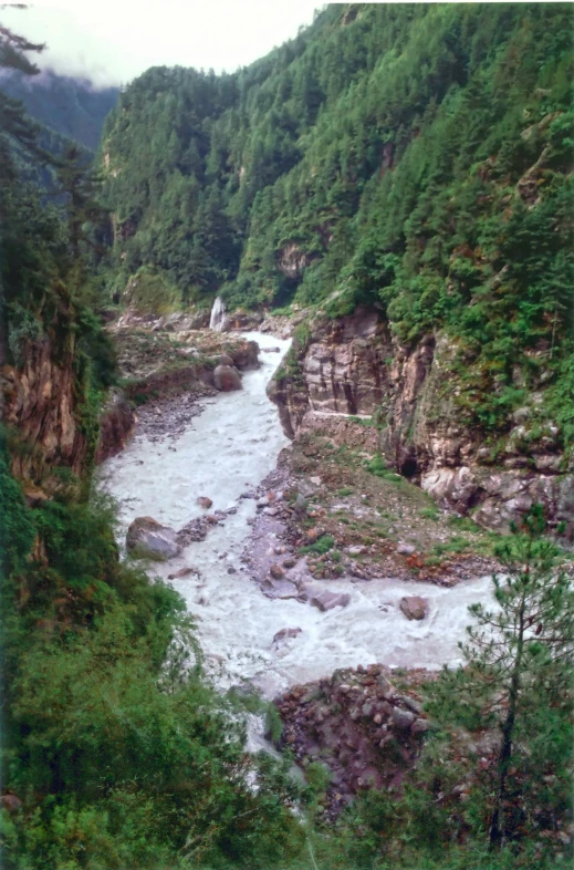 the water flows over rocks and onto the side of the hill