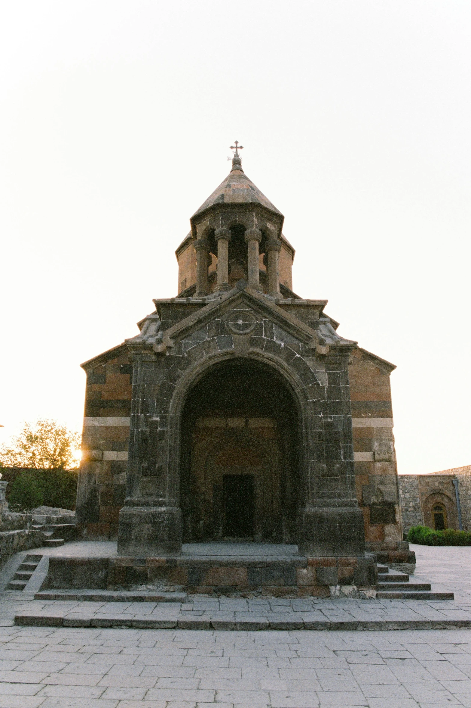 a brick church with an steeple and two steeples