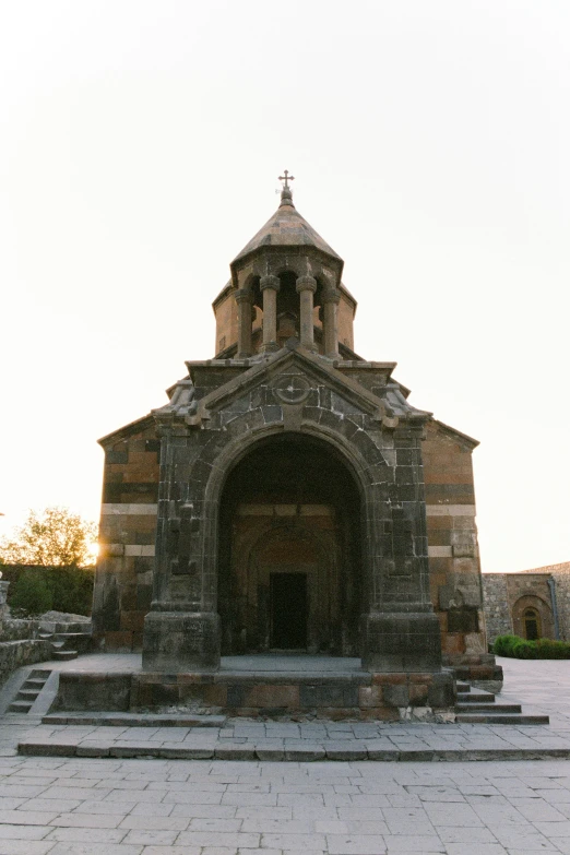 a brick church with an steeple and two steeples