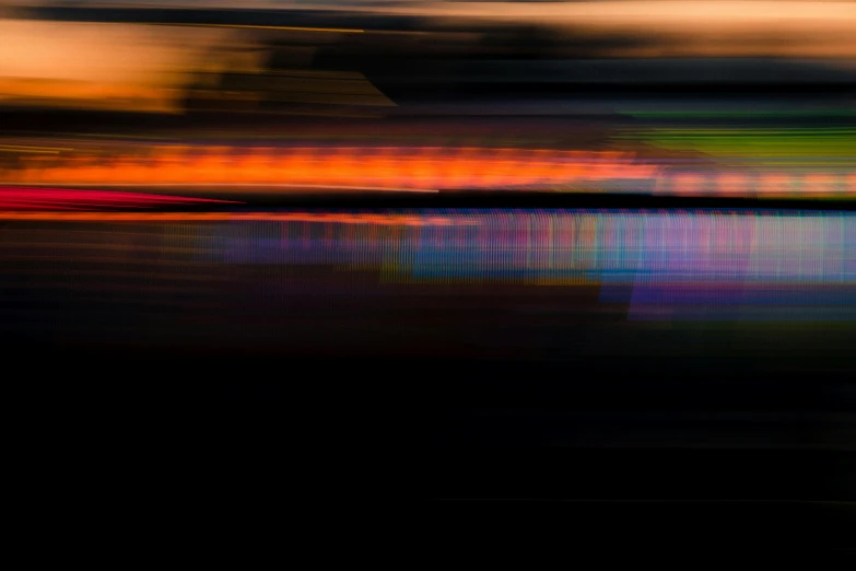 blurry abstract image of building and waterway during sunset