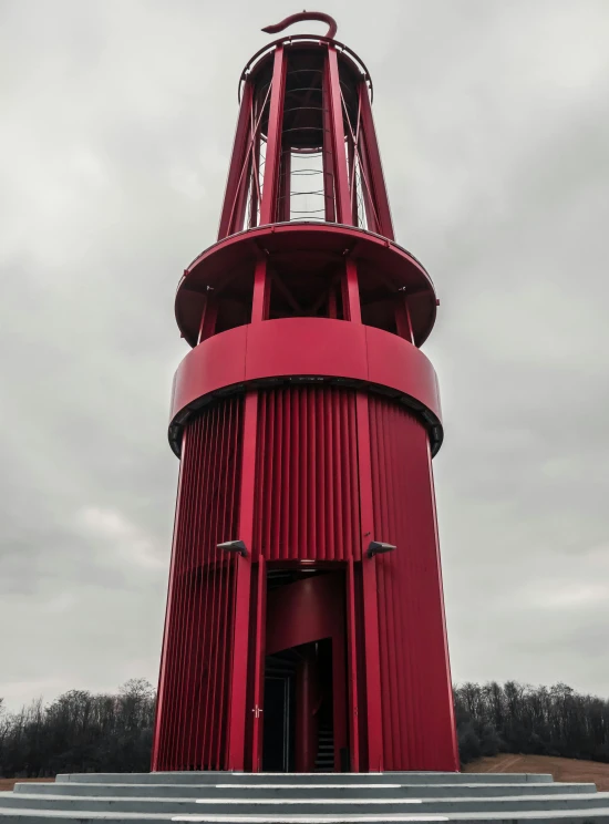 a large red tower next to some stairs