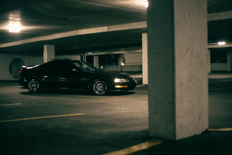 a black car parked in a car park