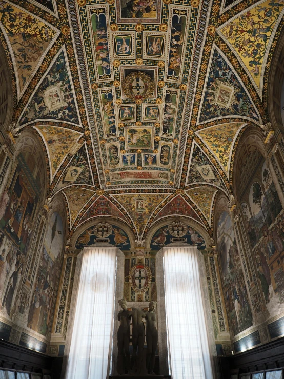 an elaborate ceiling with many different paintings on it