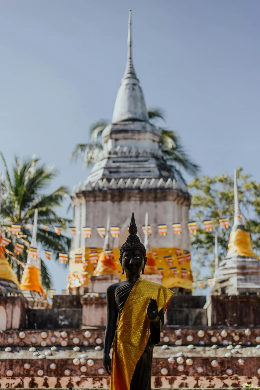 an elaborately decorated shrine with colorful flags