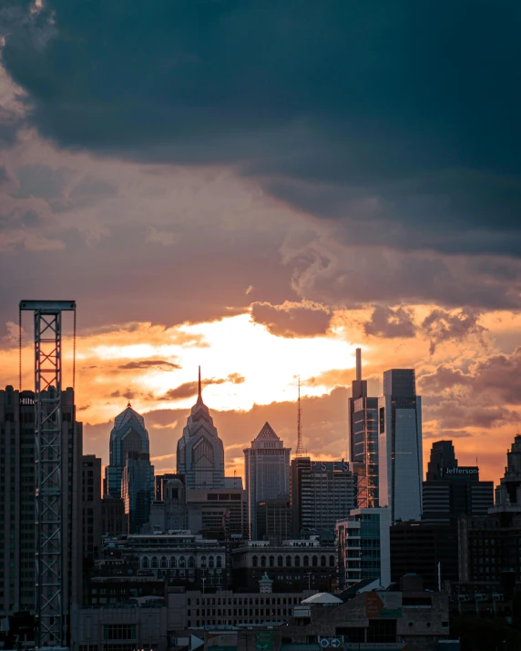 view of city skyline with bright orange and pink sky