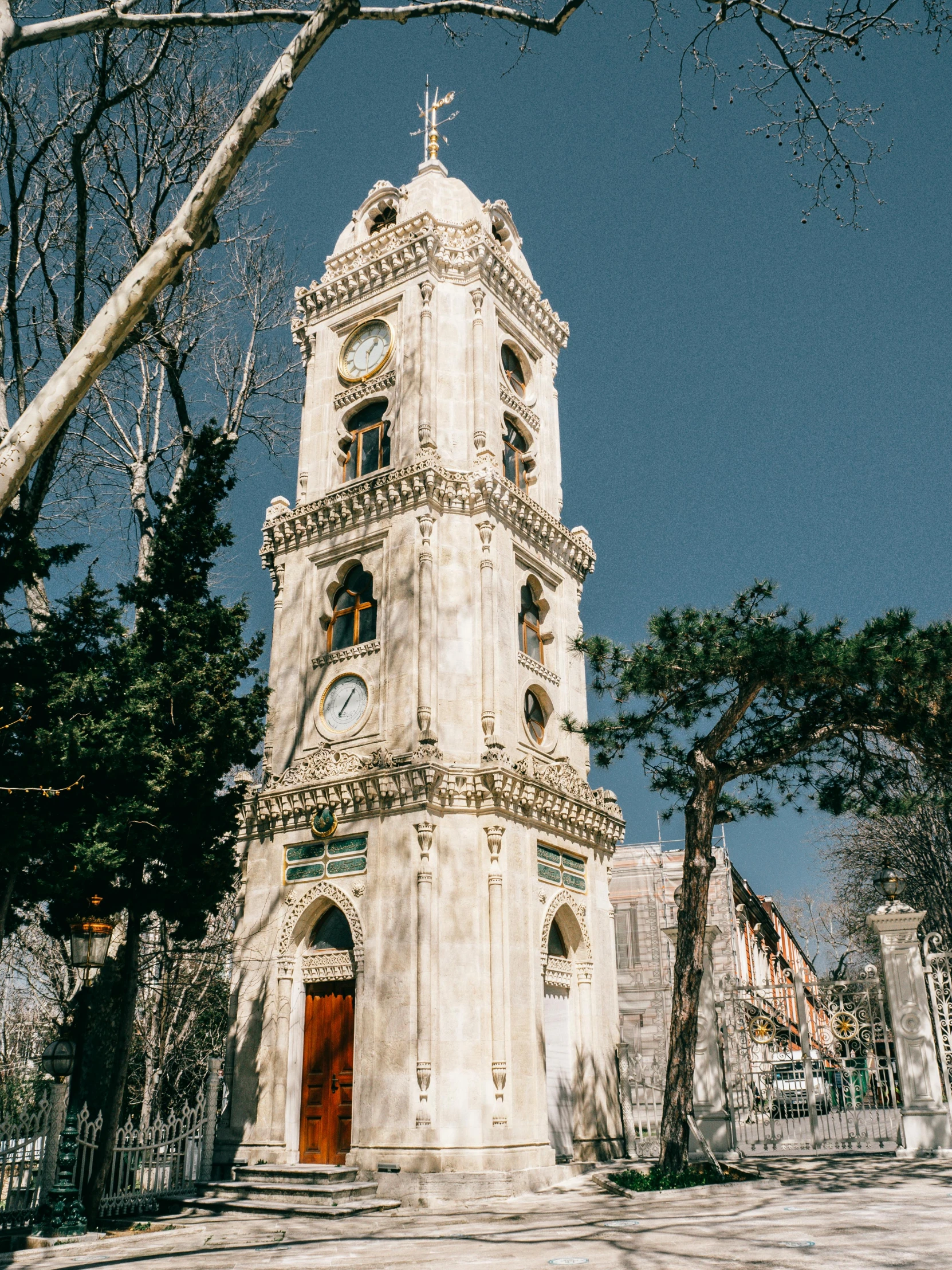 the tall white tower stands on a clear day