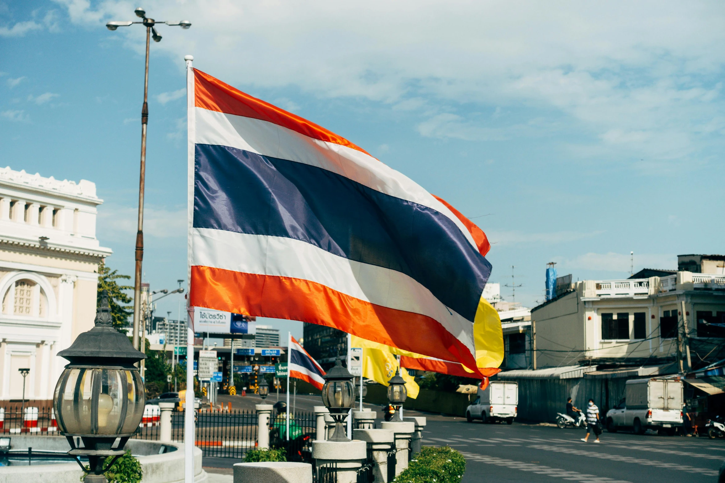 flag in the air next to street in town