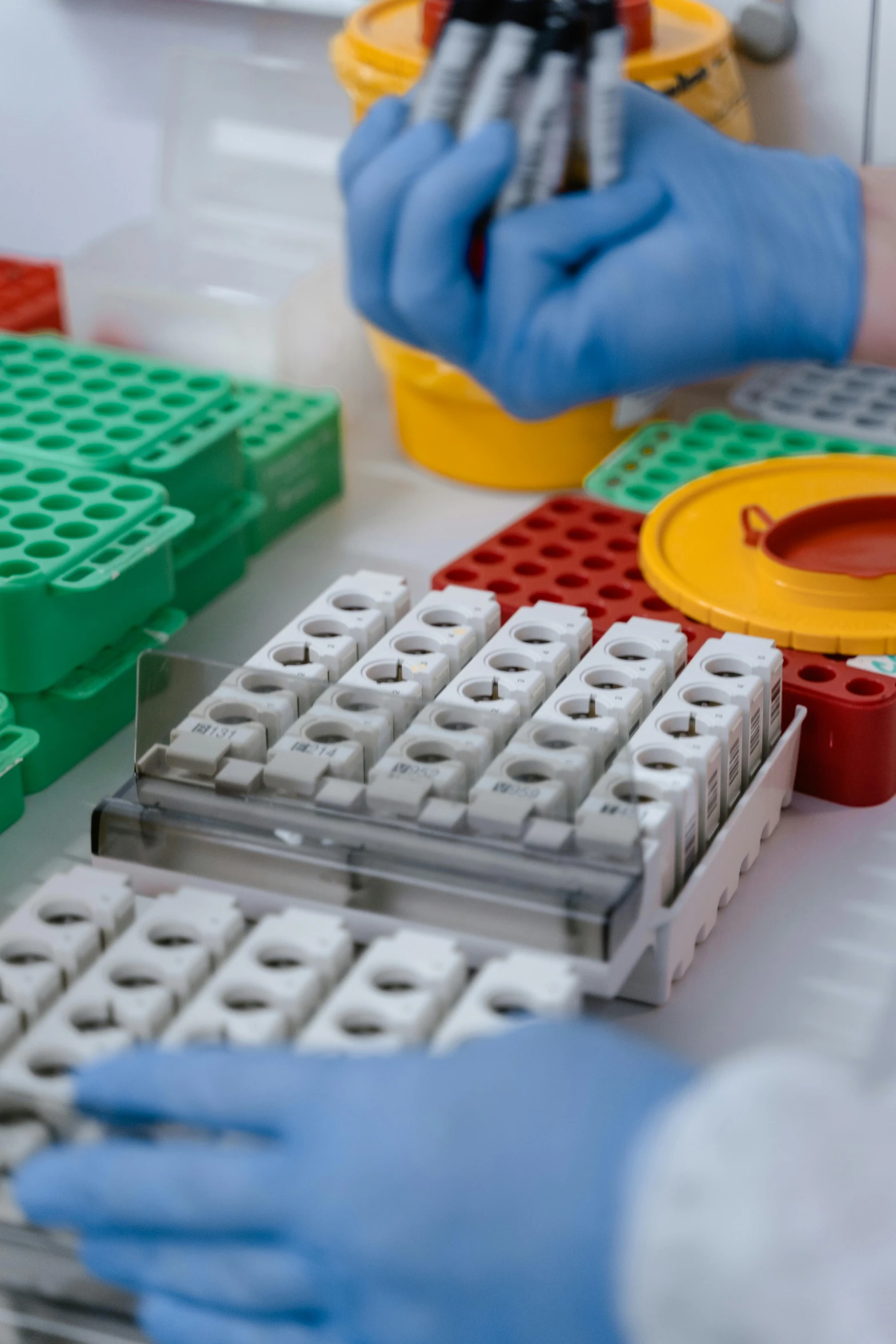 two people working with legos and making them look like they are writing on the keyboard