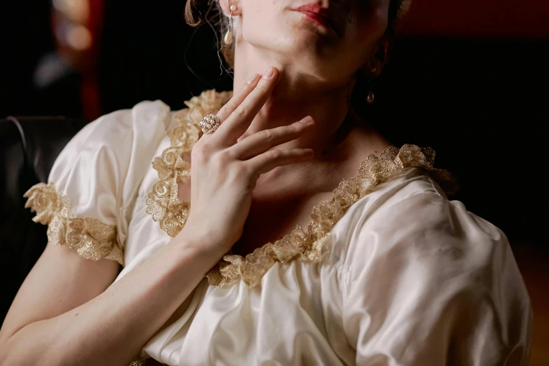 woman in a wedding gown sitting and looking up