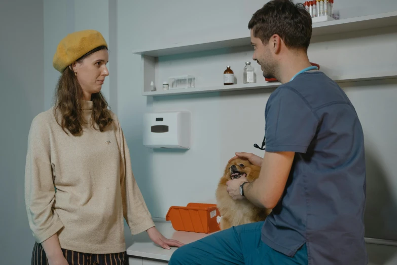man and woman standing in bathroom with their dog