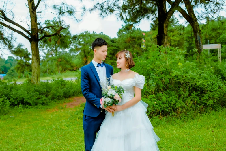 man and woman dressed in formal wear, dressed in formal attire, posing for po