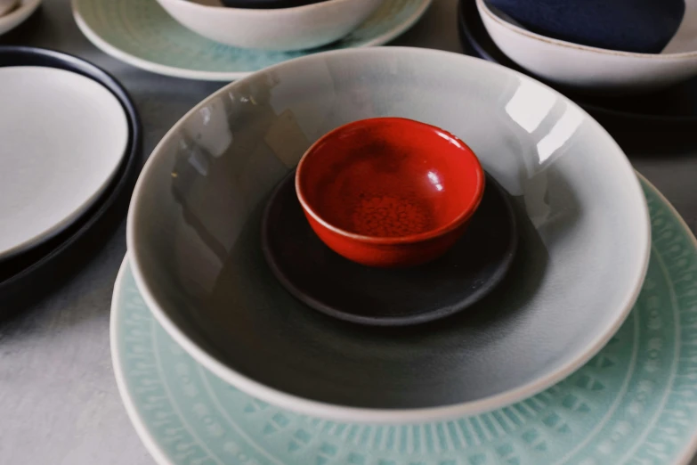 many different dishes sit together on the table