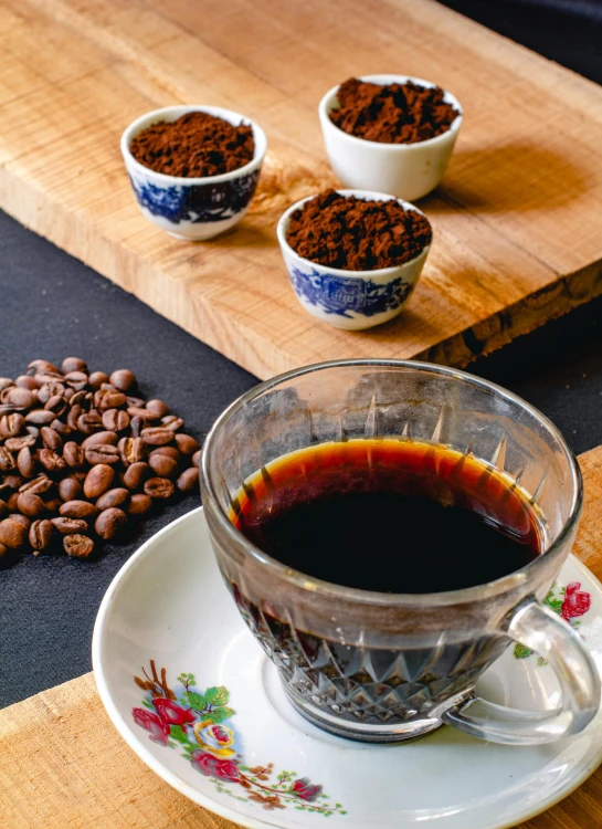 a coffee cup and saucer filled with ground coffee