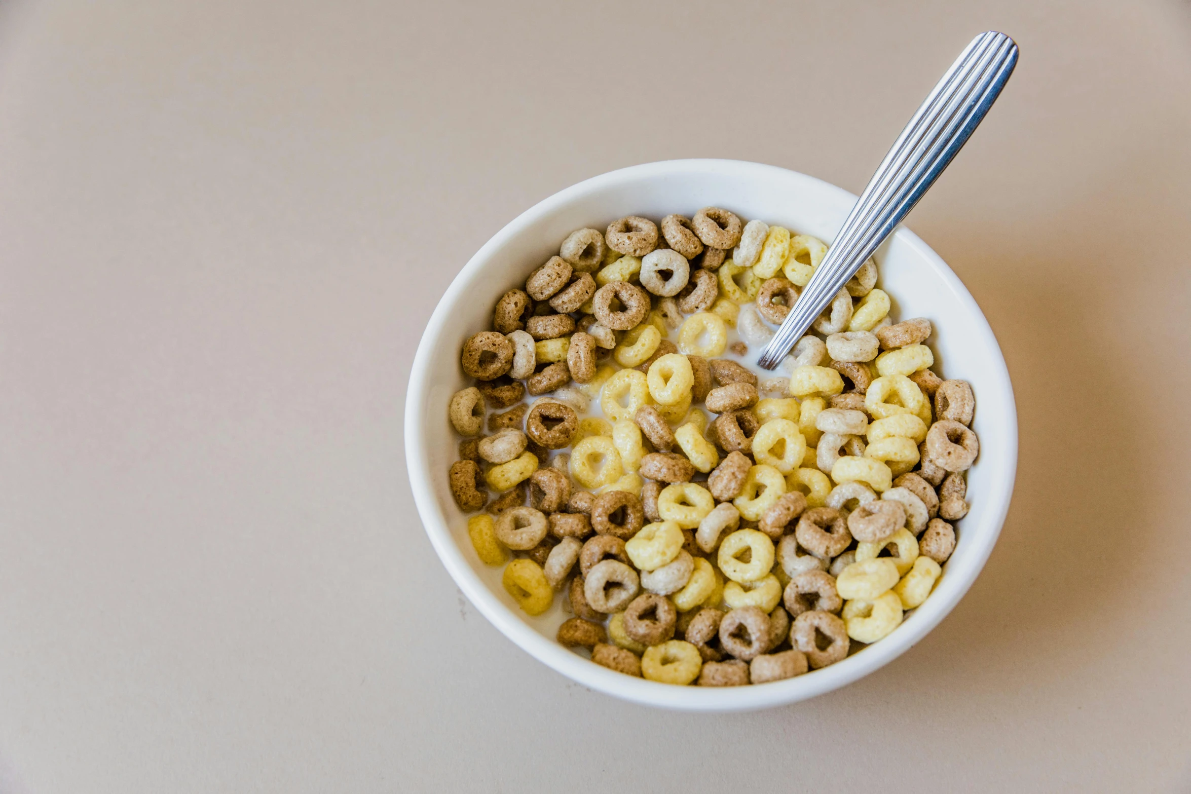 a bowl full of cereal with a spoon