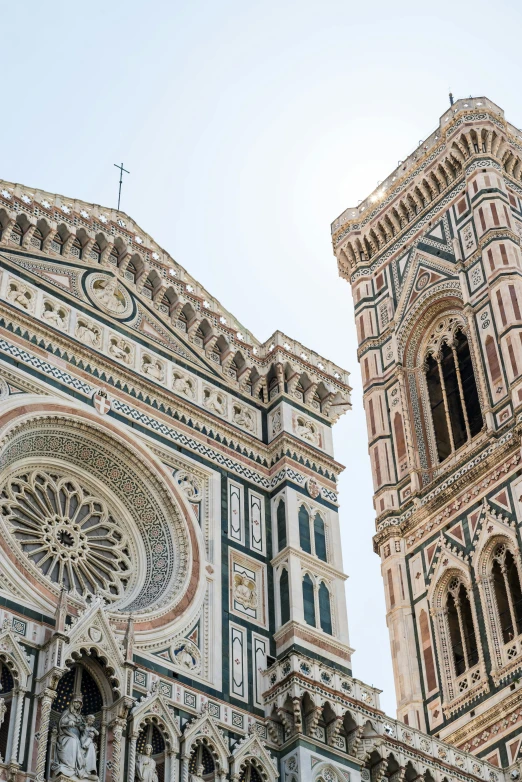 a very tall tower with a clock on it's side