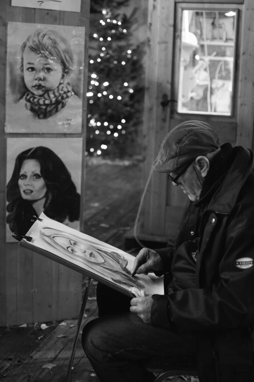 a man is reading to his girlfriend by a poster