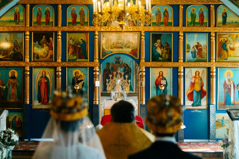 the people are sitting at the alter of the church