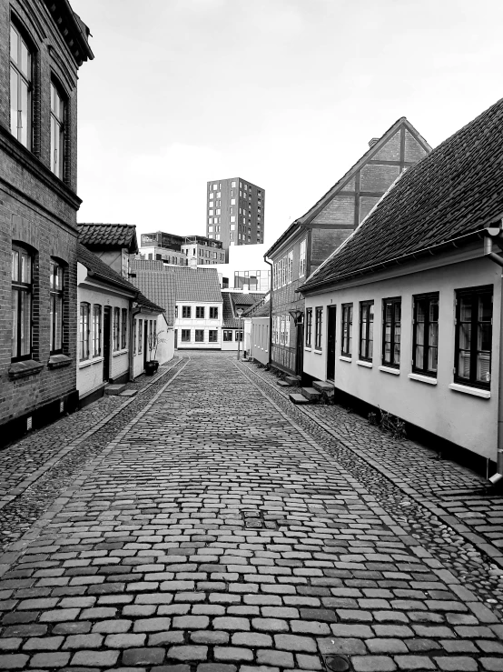 a black and white po of an empty alley way