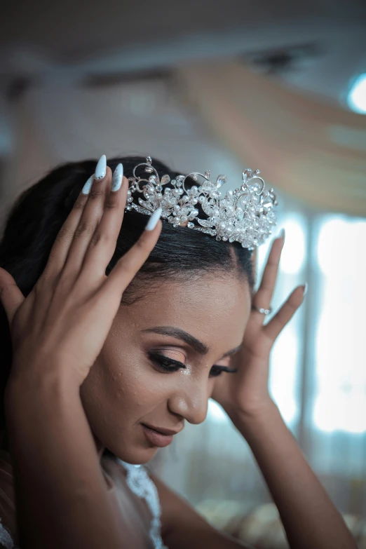 a close up of a person wearing a tiara