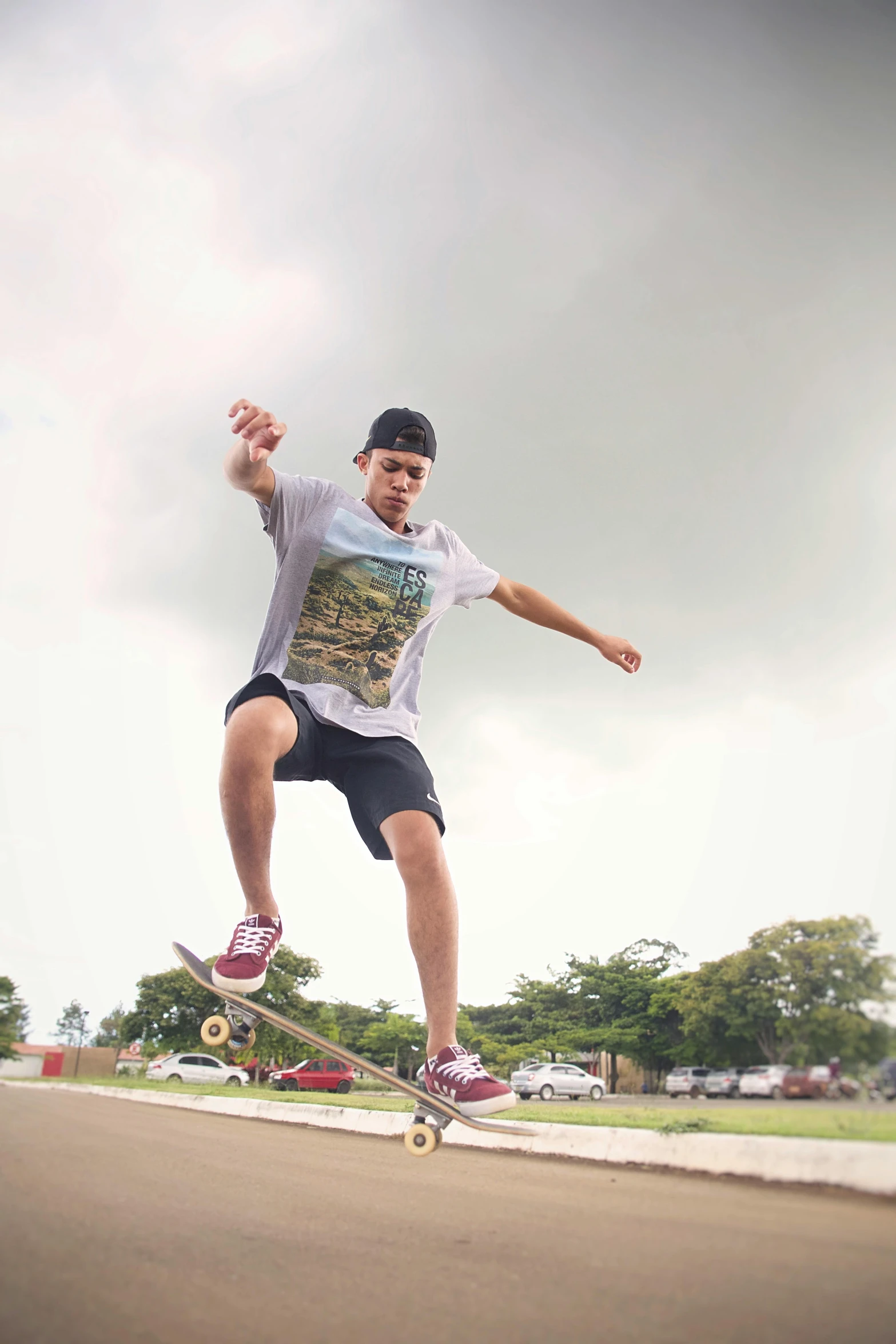 a man riding a skateboard across the top of a cement slab