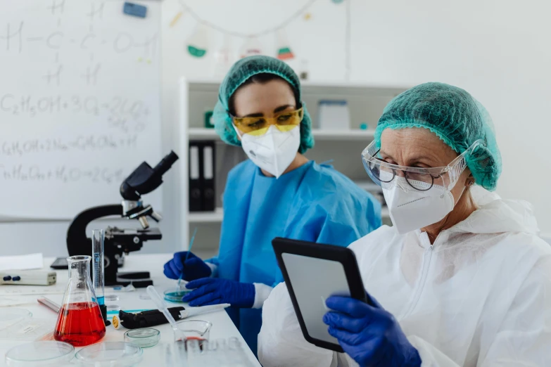 two medical workers at work in the lab