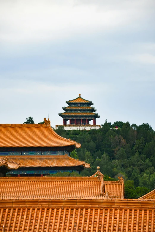 a pagoda stands in front of a mountainous area