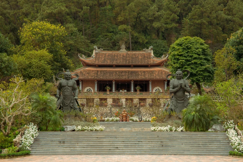 statues and steps in front of a chinese temple