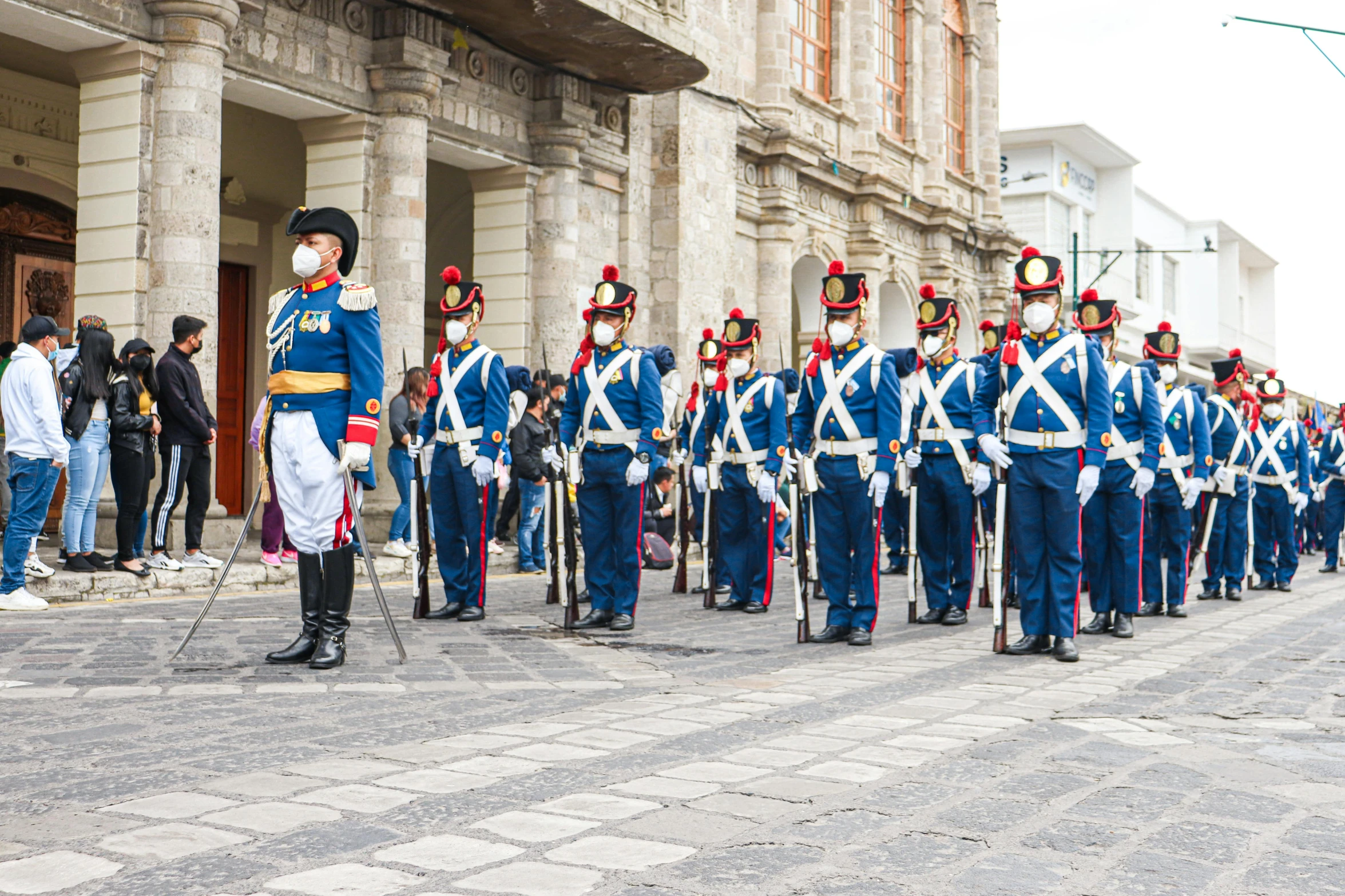 there are a lot of soldiers that are standing in the street