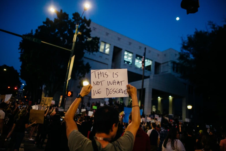 a protester holds a placard during a demonstration
