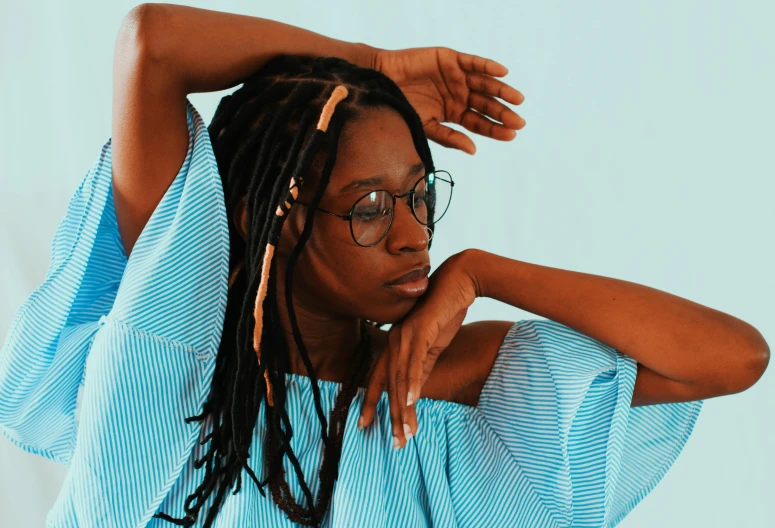 a young woman with black hair and glasses