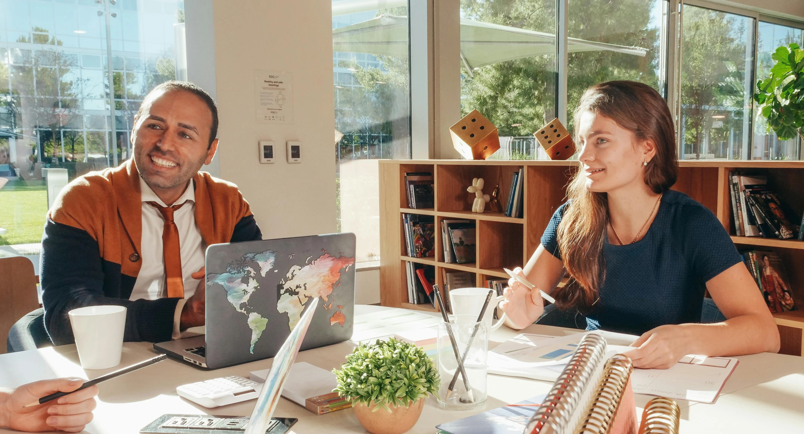 a woman is talking to a man in the computer