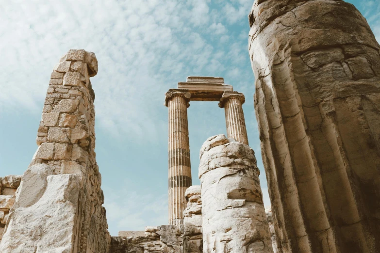 some very large stone columns with pillars under it