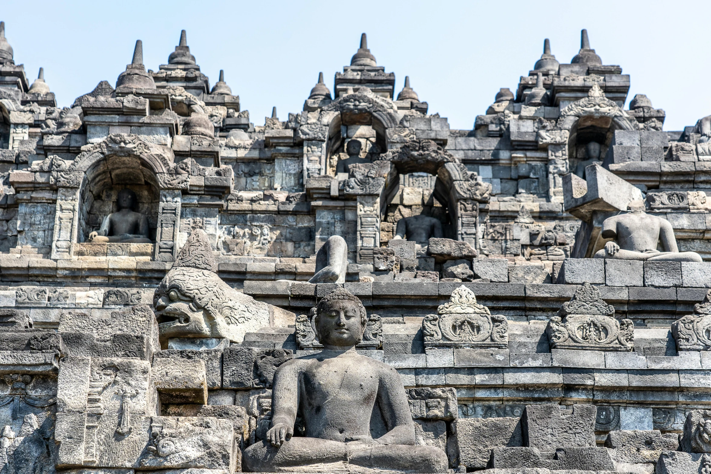 an ornate stone carving near a wall