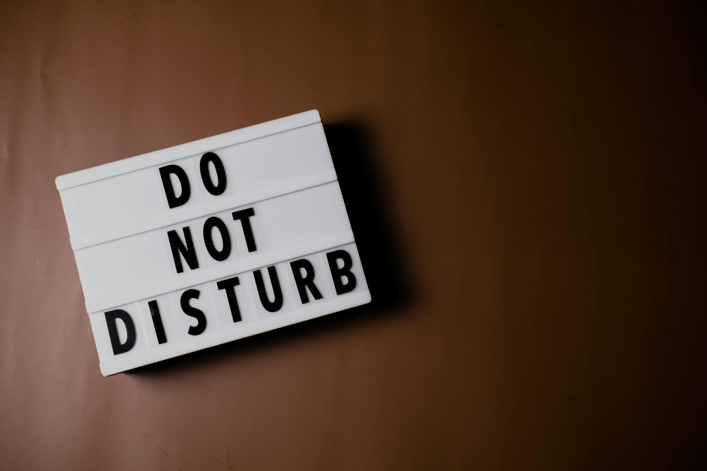 a do not disturb sign is shown on the wall