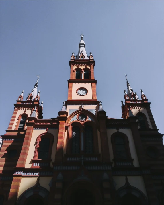 a tower of an old building with a clock on it