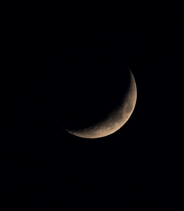 a close up of the crescent moon taken from earth