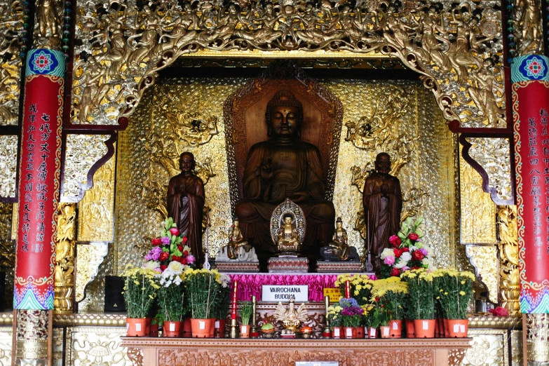 a shrine with golden and red decorations