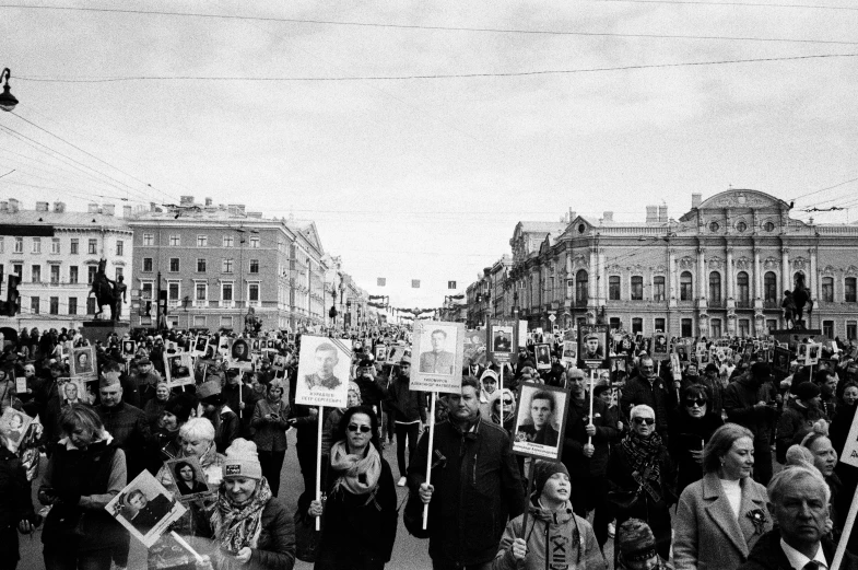 black and white image of an anti - immigrant march