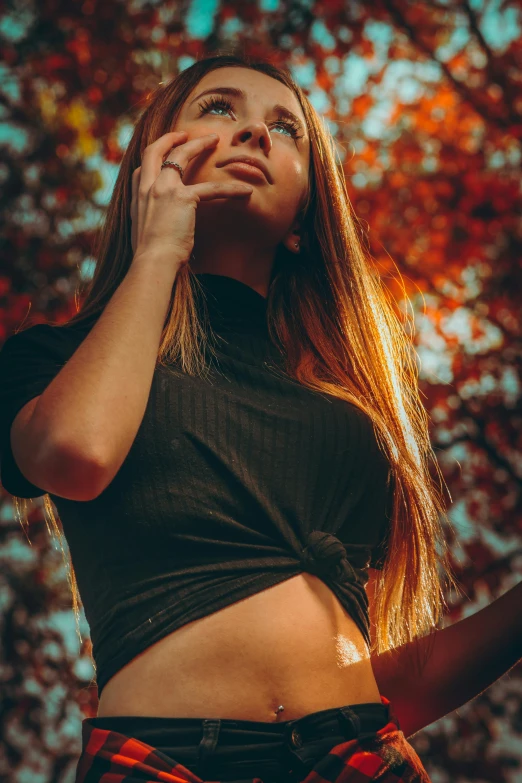 an attractive young woman talking on a cellphone