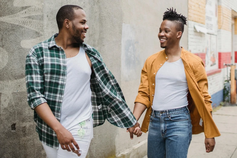 an image of two people that are holding hands