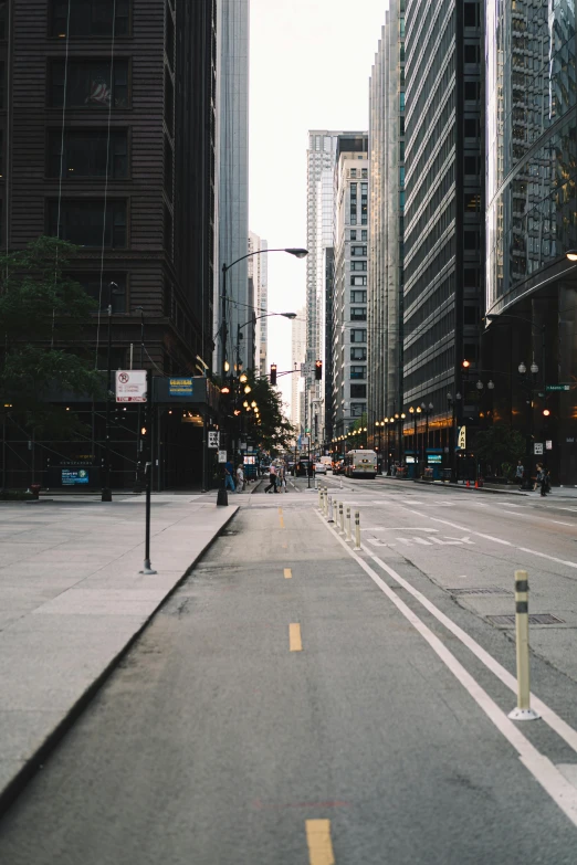 a deserted city street is shown on a very cloudy day