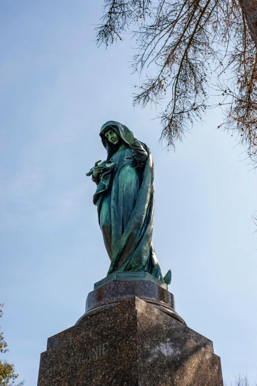 a statue of a woman on a pedestal