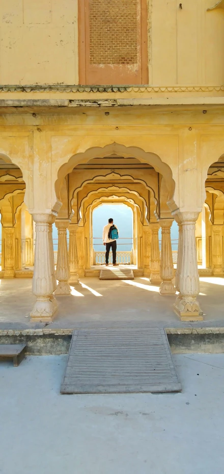 a person is standing at the end of a pier